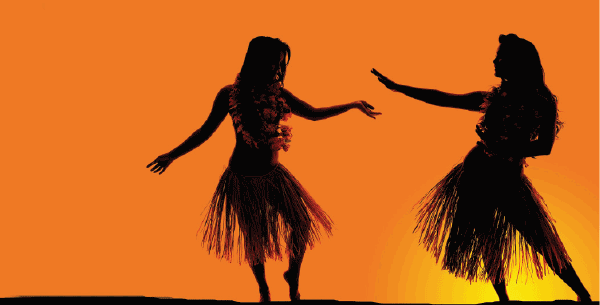 siluettes of 2 ladies in Hawaiian costumes dancing during sunset